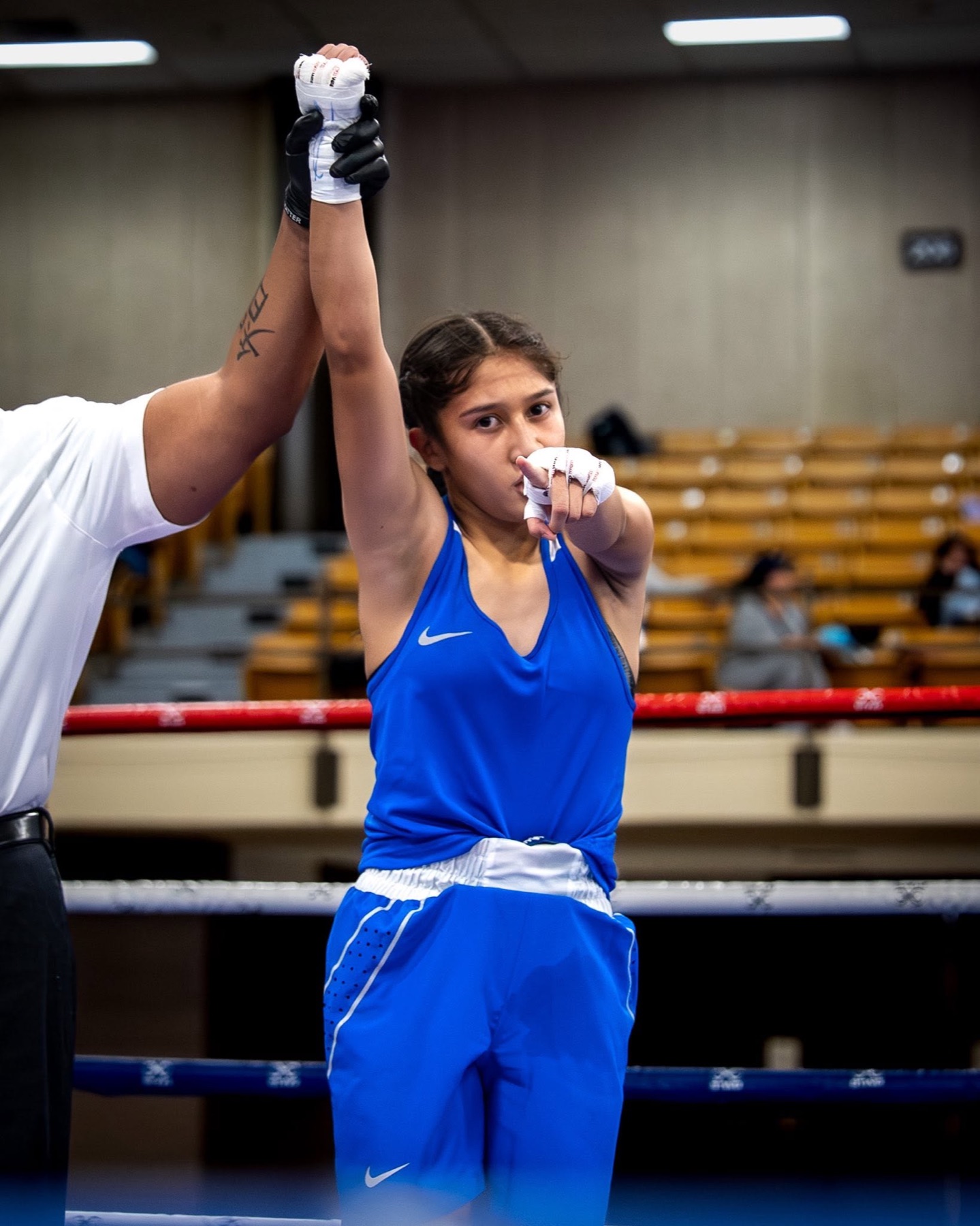 AM Pro Charities athlete having her arm raised in victory after a match